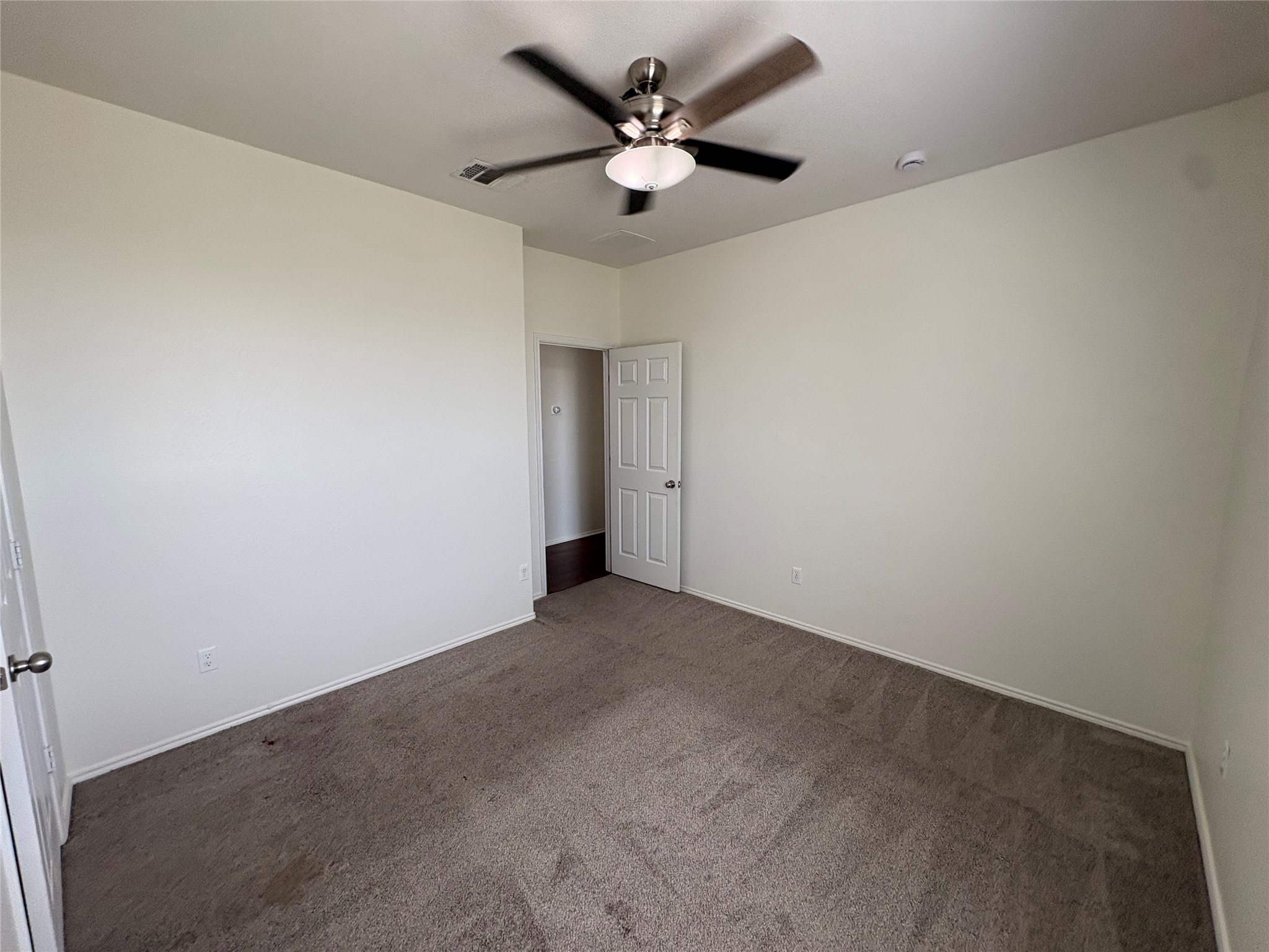 11617 Murron Drive Austin, TX 78754 - Photo 24 of 30 an empty room with a window and a ceiling fan