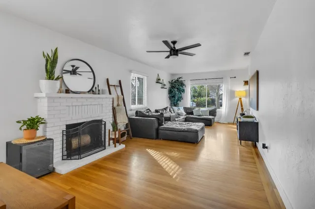 a living room with furniture and a table