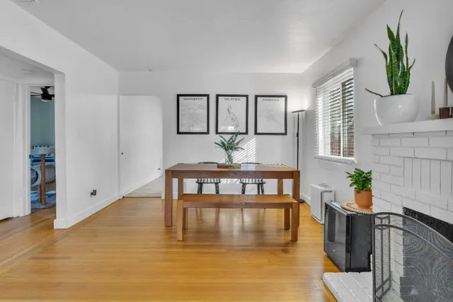 a bathroom with a granite countertop toilet sink and mirror