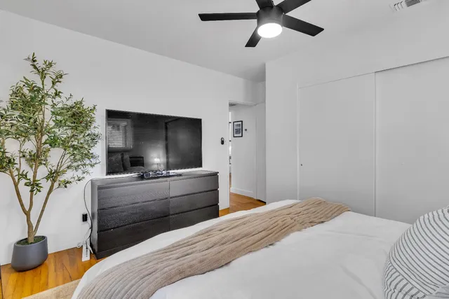 a bedroom with bed and a window