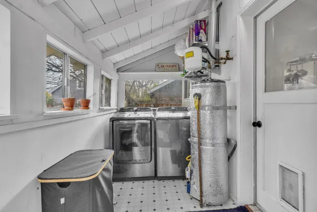 a bathroom with a sink a mirror and shower