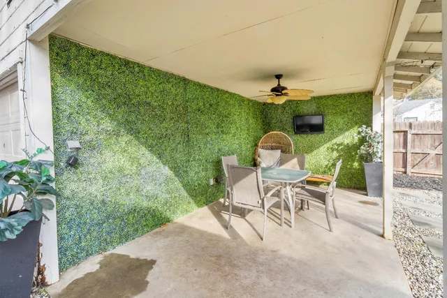 a view of a yard with a house and a tree