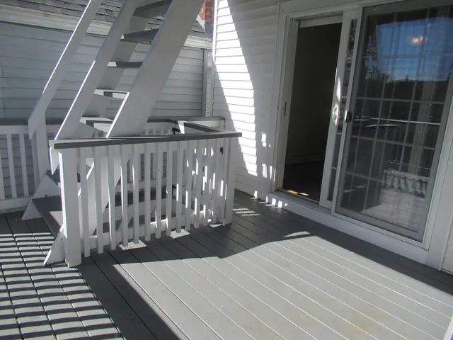 a view of a balcony with chairs