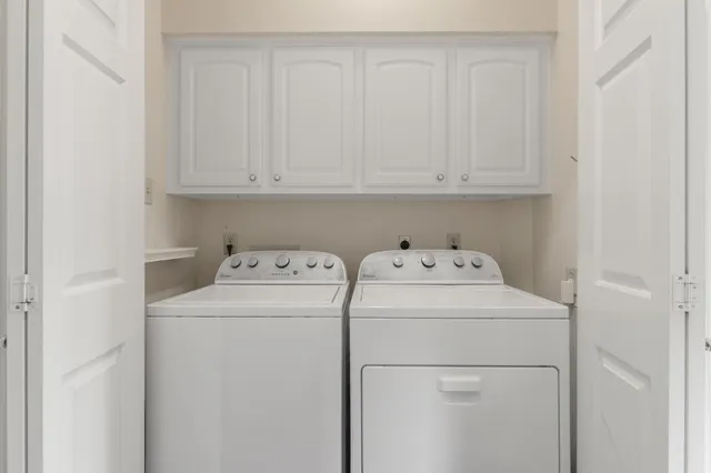 a bathroom with a sink double vanity and a shower