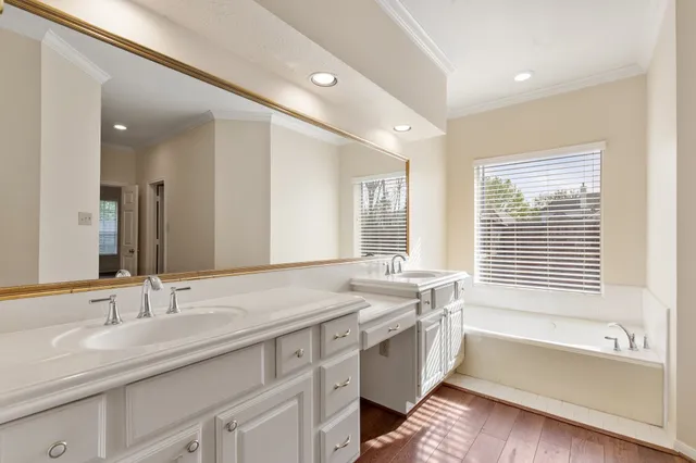 a view of a house with a yard and tree