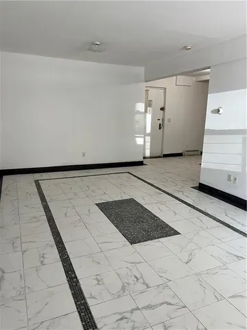 an empty room with a empty space and window