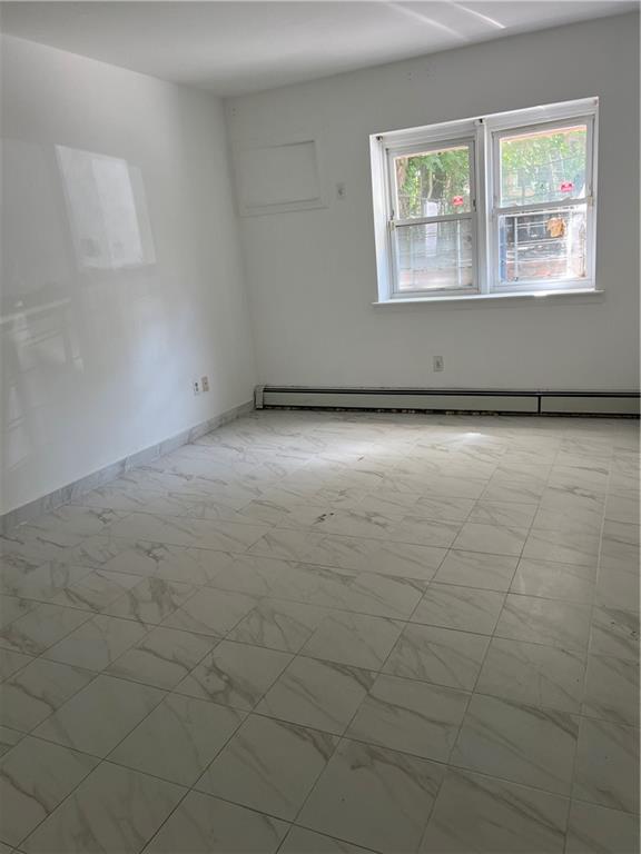 2955 Ocean Parkway, Unit BR Brooklyn, NY 11235 - Photo 3 of 6 an empty room with a empty space and window