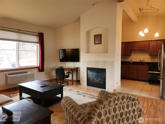 a bedroom with a bed and a fireplace