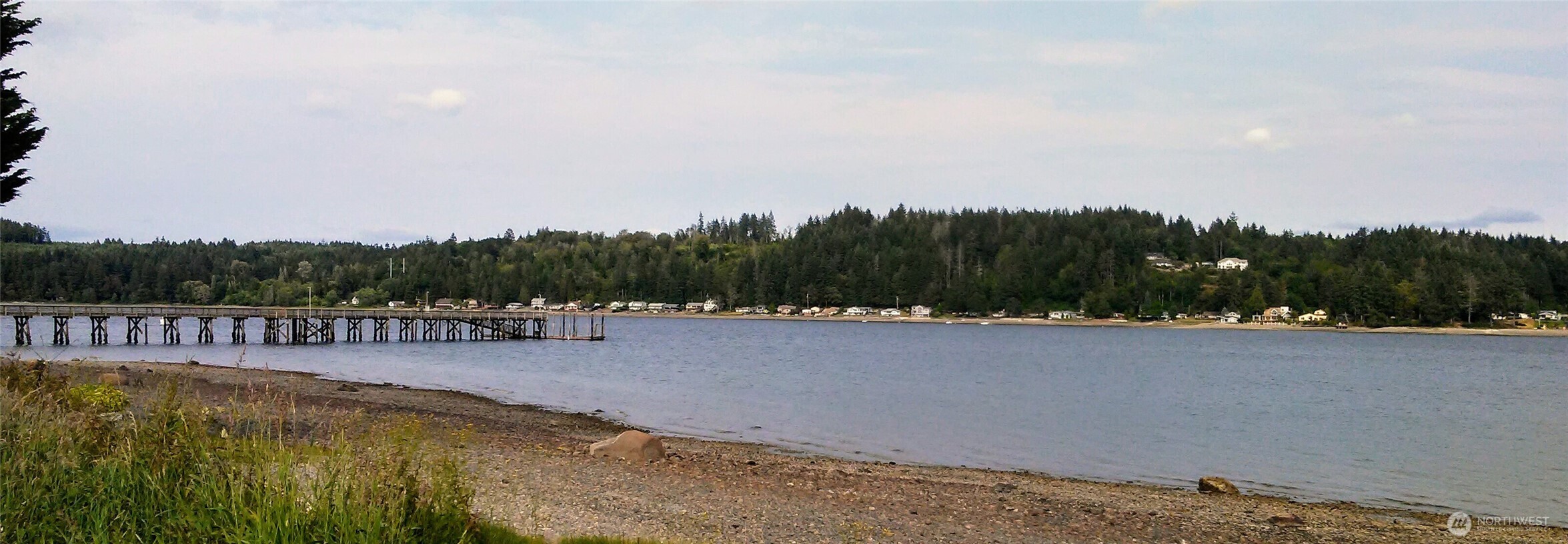 18350 Highway 3 Allyn, WA 98524 - Photo 17 of 18 a view of a swimming pool and trees in the background