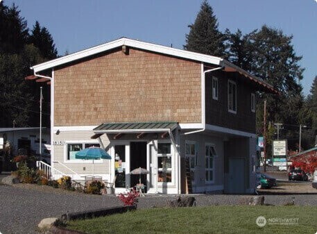 18350 Highway 3 Allyn, WA 98524 - Photo 18 of 18 a front view of a house with a yard