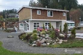 18350 Highway 3 Allyn, WA 98524 - Photo 6 of 18 a front view of a house with garden