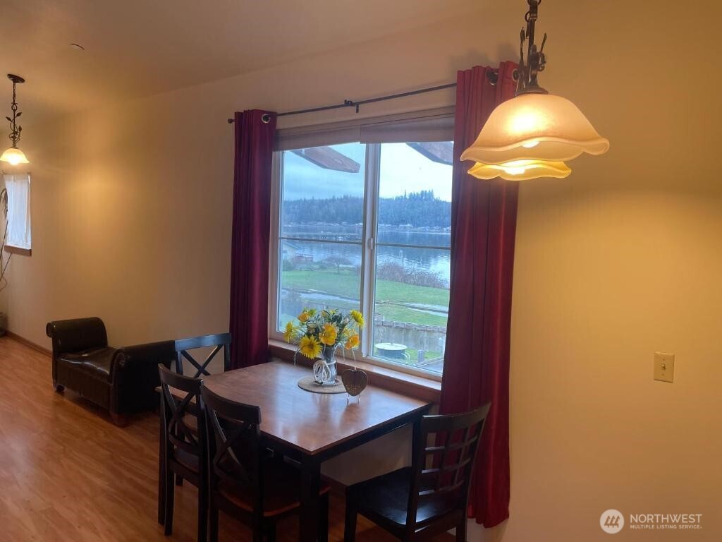 18350 Highway 3 Allyn, WA 98524 - Photo 8 of 18 a view of a dining room with furniture and window