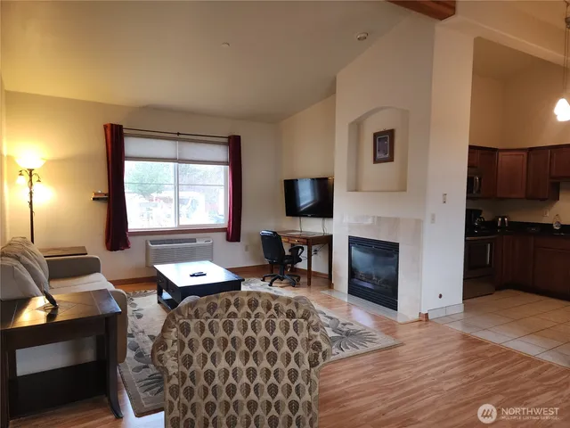 a bed room with a bed and a television