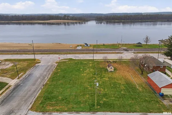 a view of a lake with a big yard