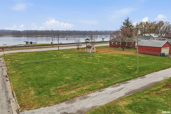 a view of a water fountain and a big yard