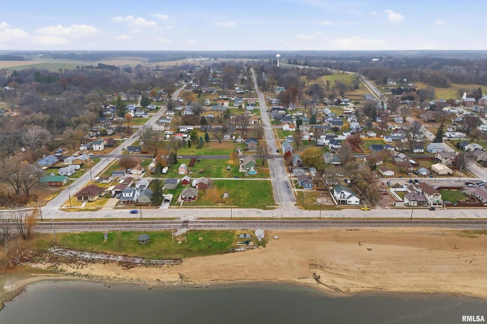 702-708 West Front Street Buffalo, IA 52728 - Photo 4 of 8 an aerial view of a residential houses with yard and ocean view