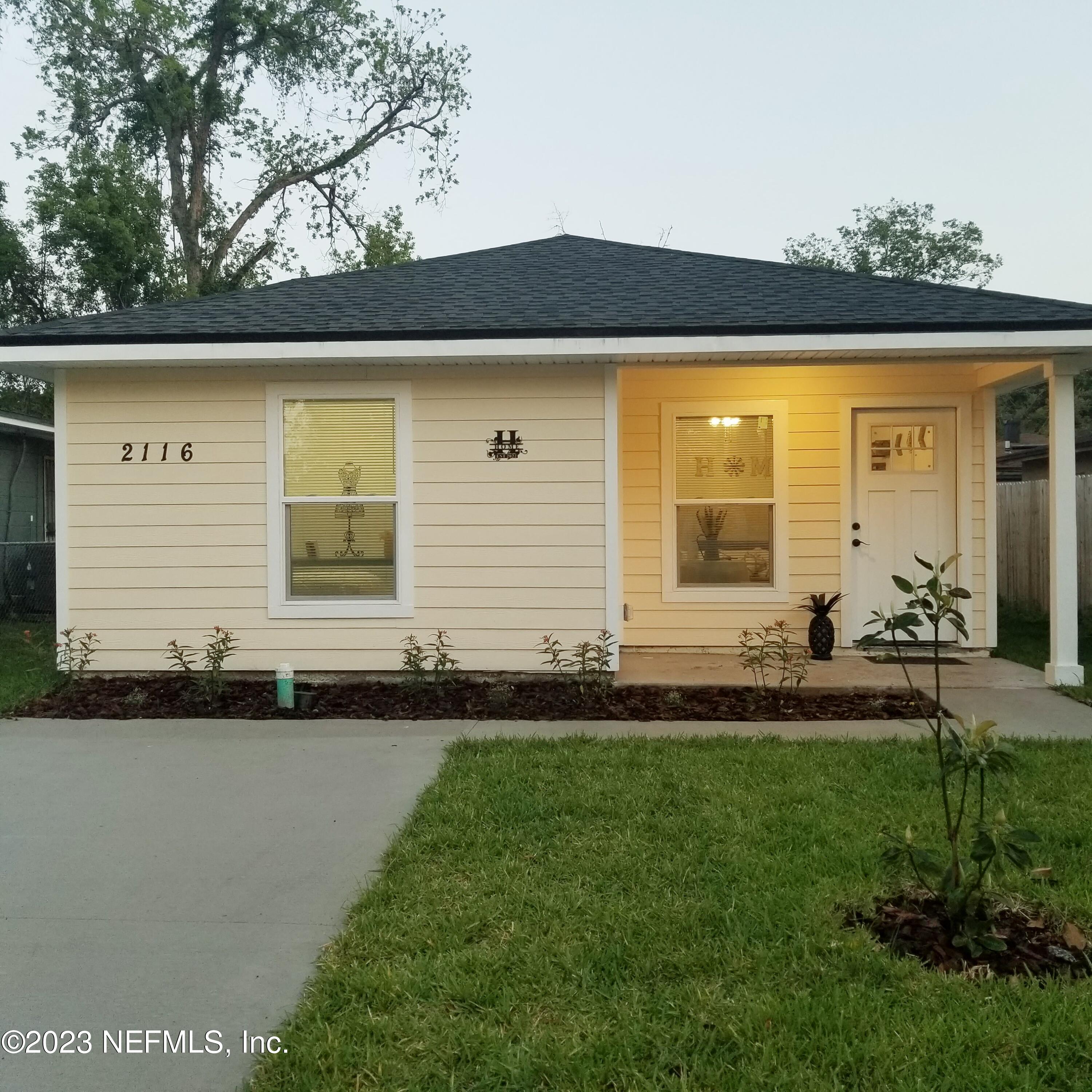 2116 Yulee Street Jacksonville, FL 32209 - Photo 1 of 12 a front view of a house with a yard
