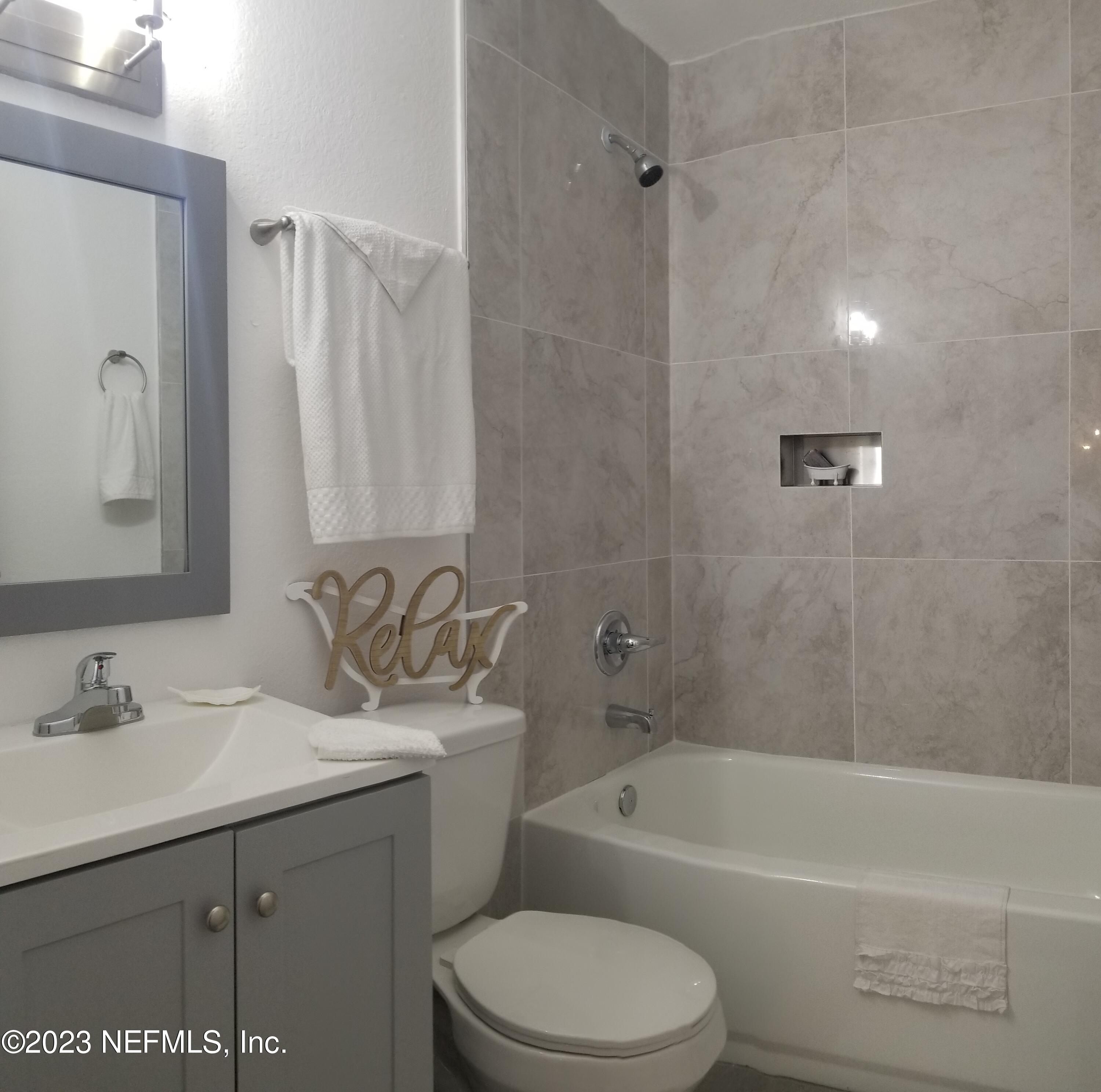 2116 Yulee Street Jacksonville, FL 32209 - Photo 12 of 12 a bathroom with a sink toilet and shower