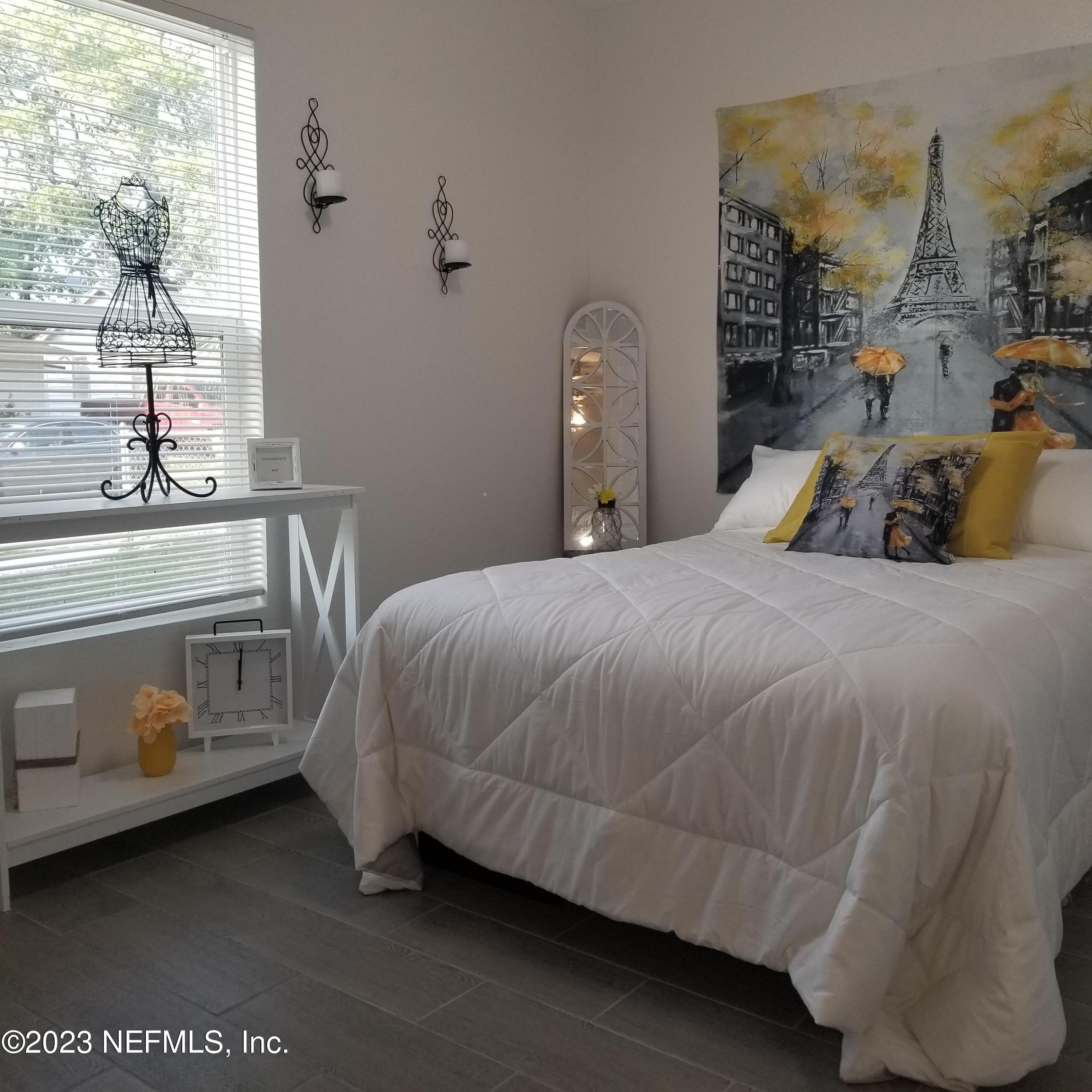 2116 Yulee Street Jacksonville, FL 32209 - Photo 5 of 12 a bedroom with a bed and window