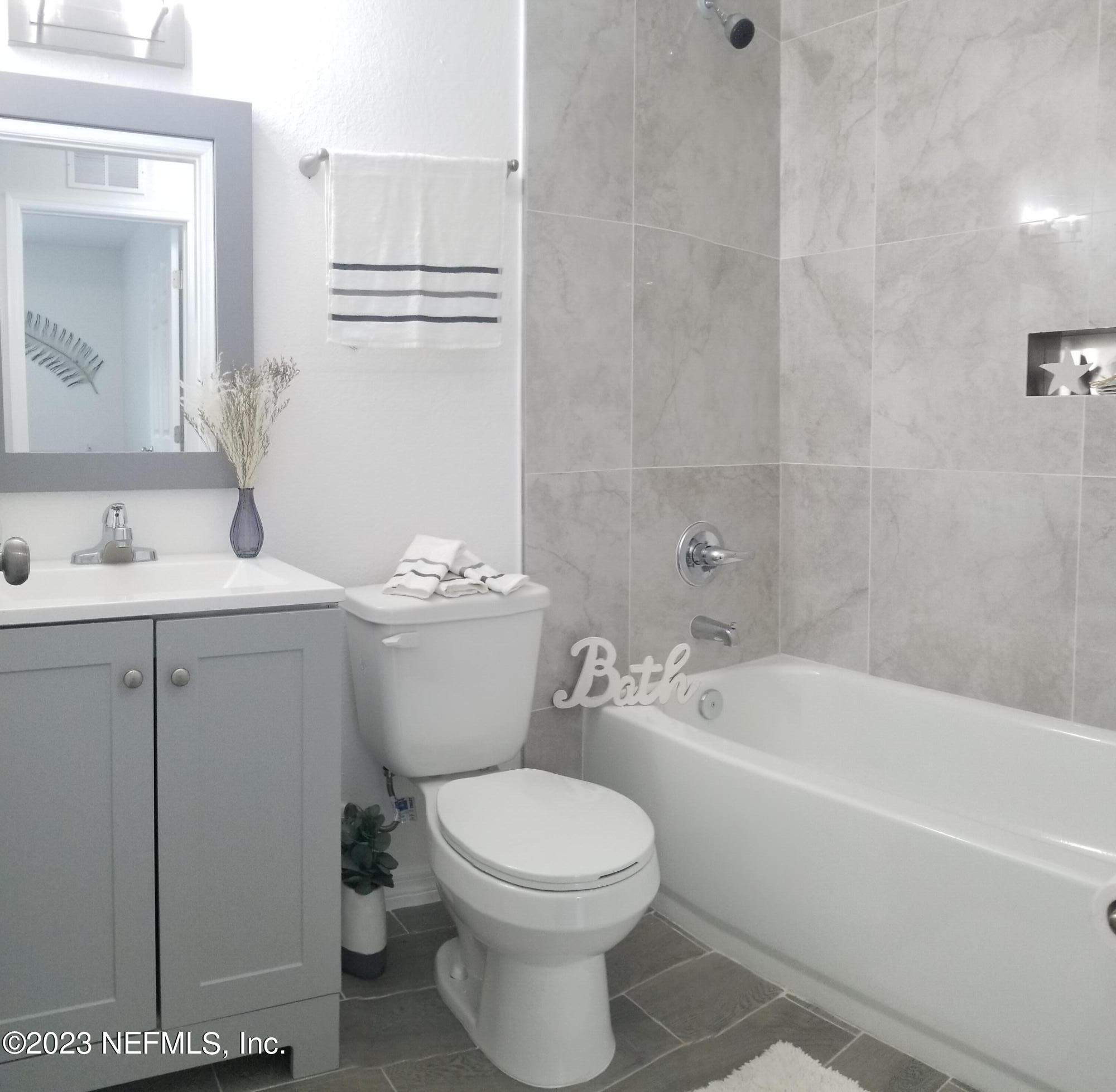 2116 Yulee Street Jacksonville, FL 32209 - Photo 7 of 12 a bathroom with a toilet a sink and bathtub