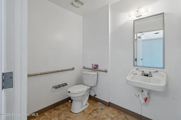 a bathroom with a sink toilet and vanity