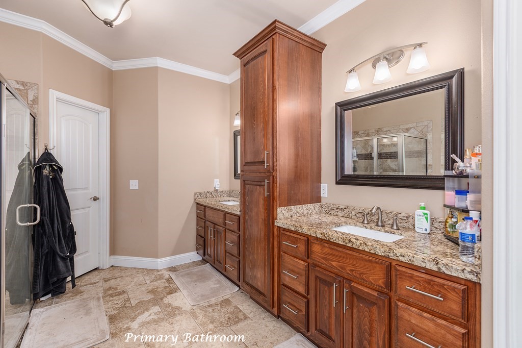 1171 Old Ewing Road Lufkin, TX 75901 - Photo 19 of 49 a bathroom with a sink a vanity and a mirror