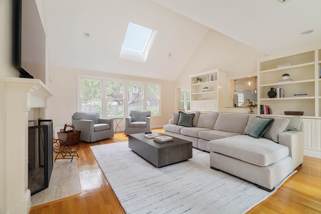 38 Fuller Brook Road Wellesley, MA 02482 - Photo 15 of 42 a living room with furniture fireplace and a flat screen tv