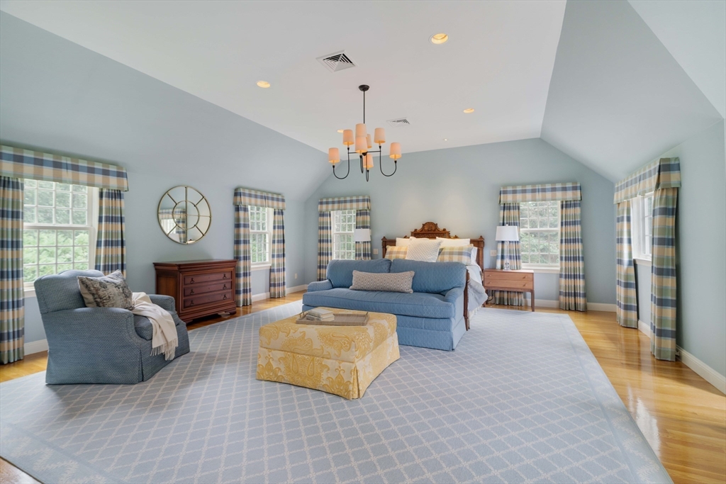 38 Fuller Brook Road Wellesley, MA 02482 - Photo 20 of 42 a living room with furniture a large window and a clock
