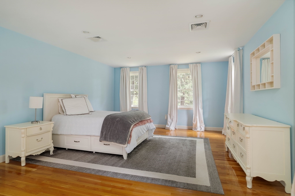 38 Fuller Brook Road Wellesley, MA 02482 - Photo 28 of 42 a spacious bedroom with a bed and a window