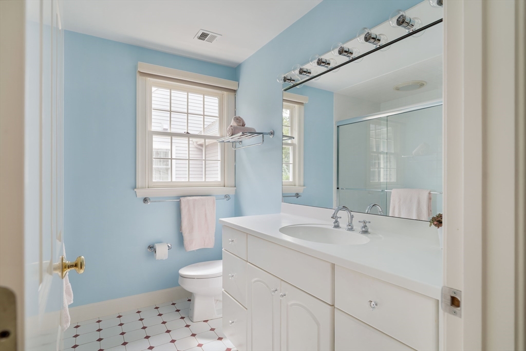 38 Fuller Brook Road Wellesley, MA 02482 - Photo 29 of 42 a bathroom with a sink a toilet and a mirror