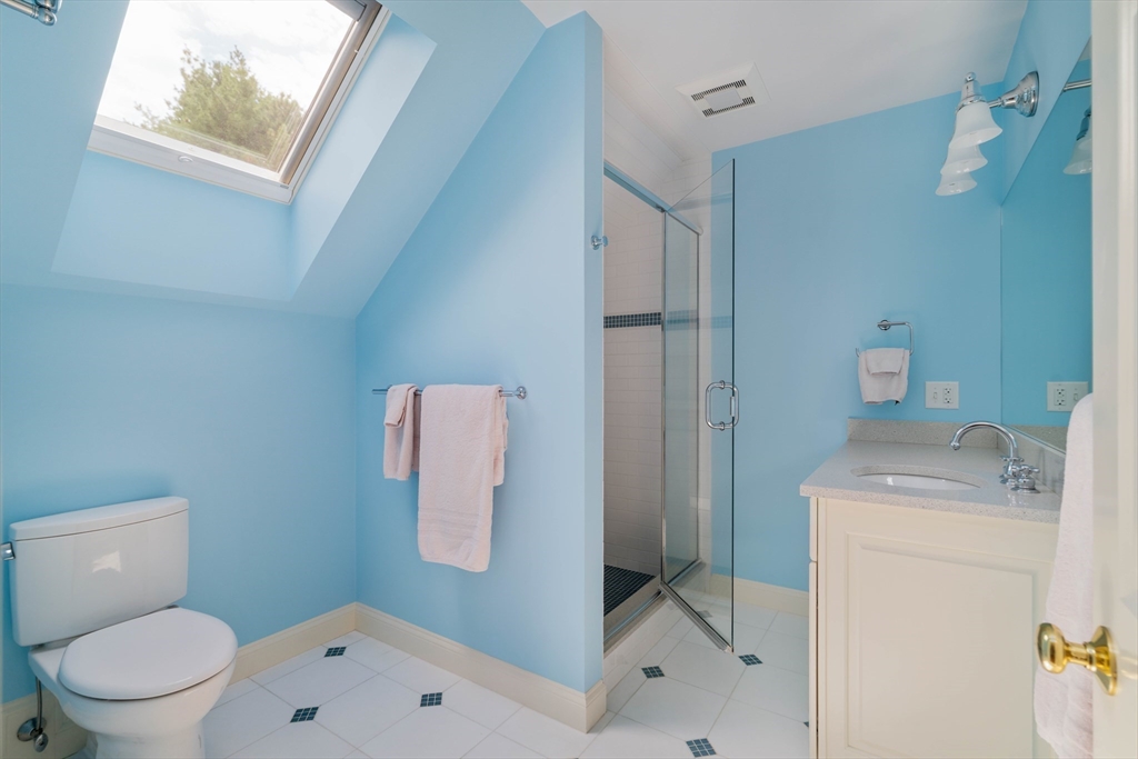 38 Fuller Brook Road Wellesley, MA 02482 - Photo 35 of 42 a bathroom with a granite countertop toilet sink and mirror