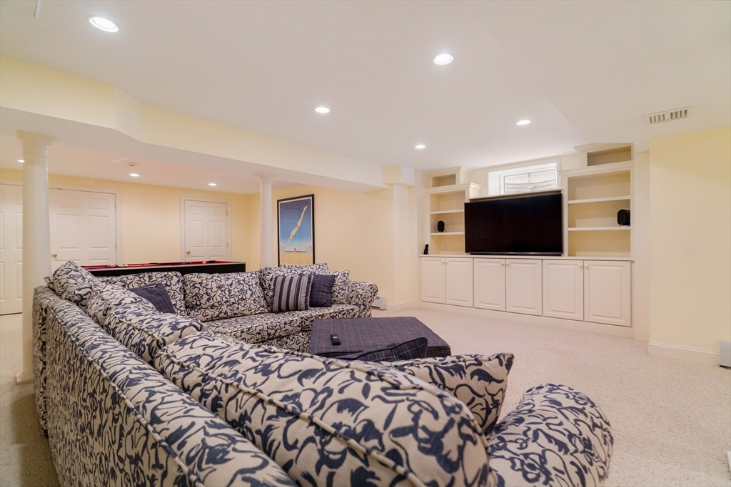 38 Fuller Brook Road Wellesley, MA 02482 - Photo 36 of 42 a large bedroom with a bed and a television in it