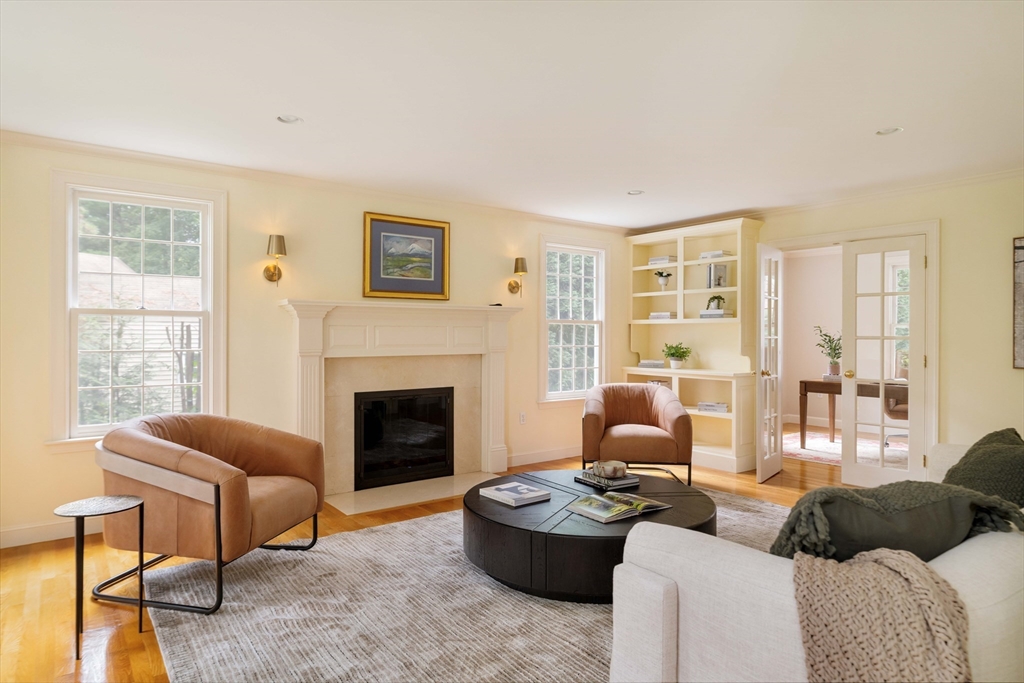 38 Fuller Brook Road Wellesley, MA 02482 - Photo 4 of 42 a living room with furniture a fireplace and a large window