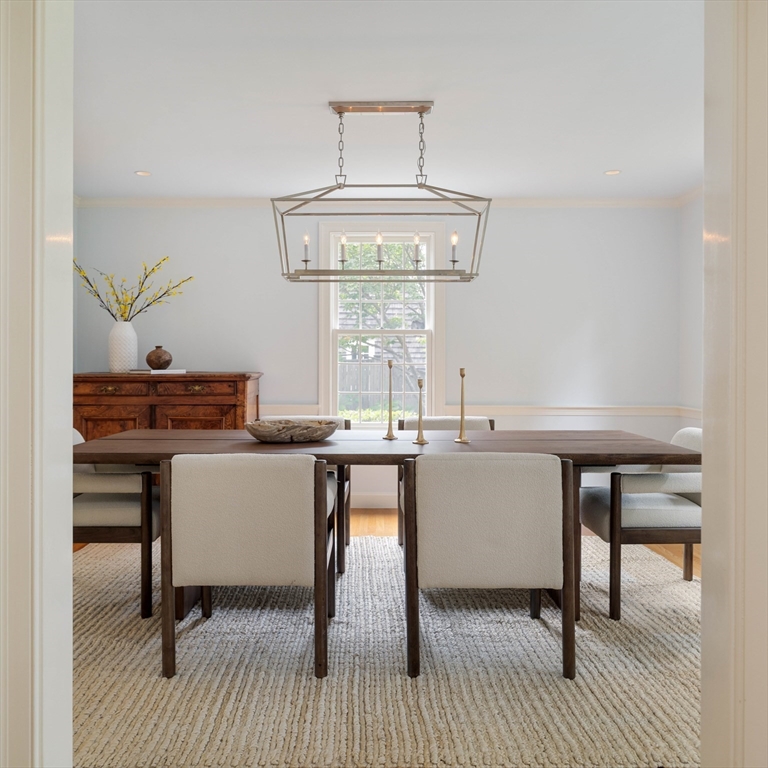 38 Fuller Brook Road Wellesley, MA 02482 - Photo 8 of 42 a dining room with a window table and chairs