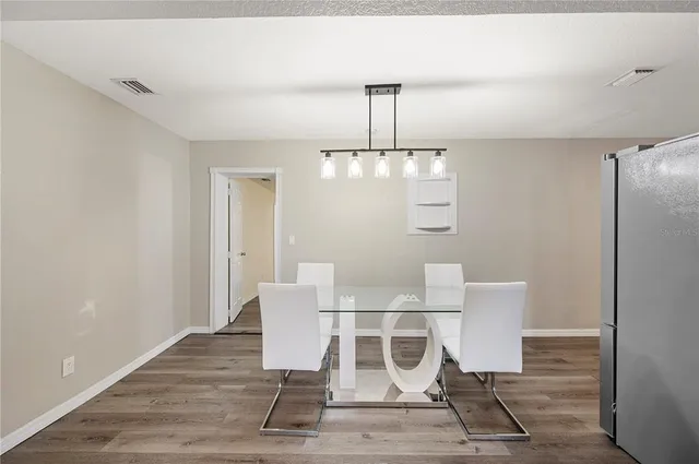 a view of a dining room with furniture