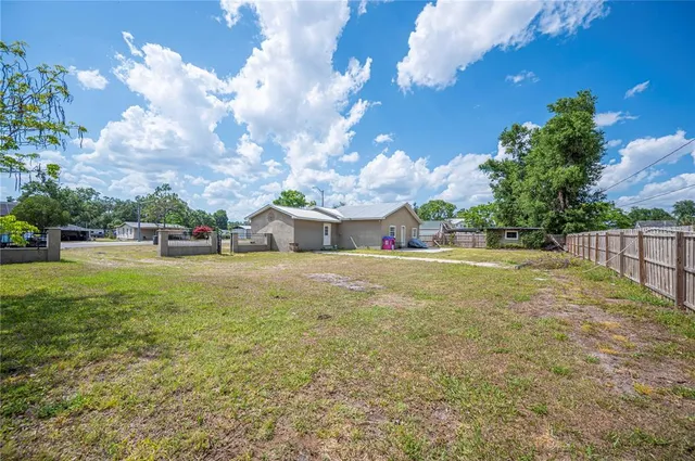 a view of backyard with green space