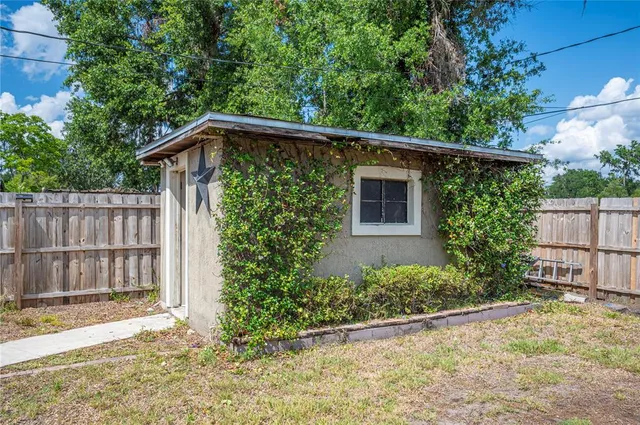 a view of a swimming pool with a yard