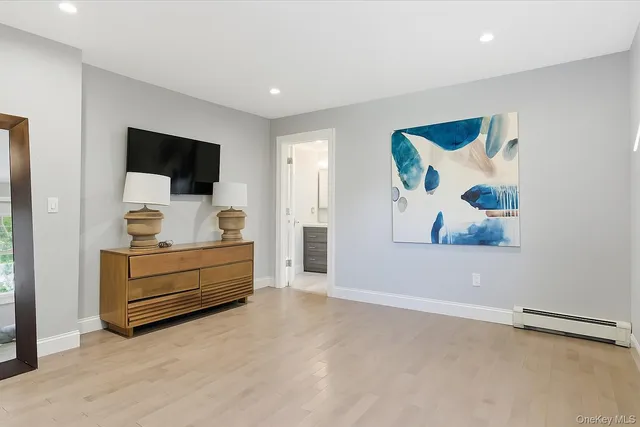 a room with furniture and a flat screen tv