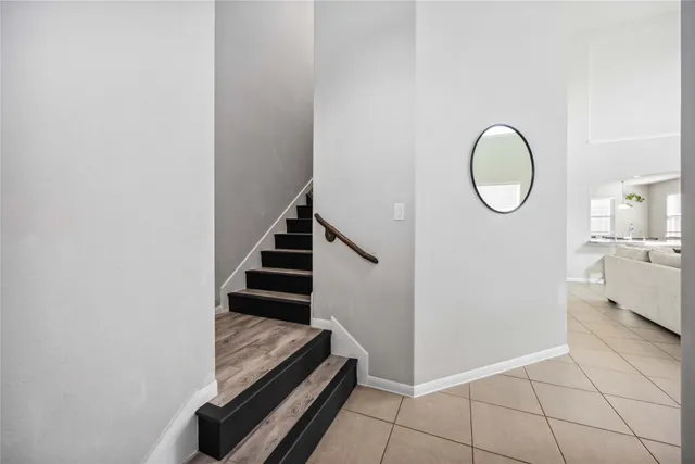 a view of a hallway with washer and dryer
