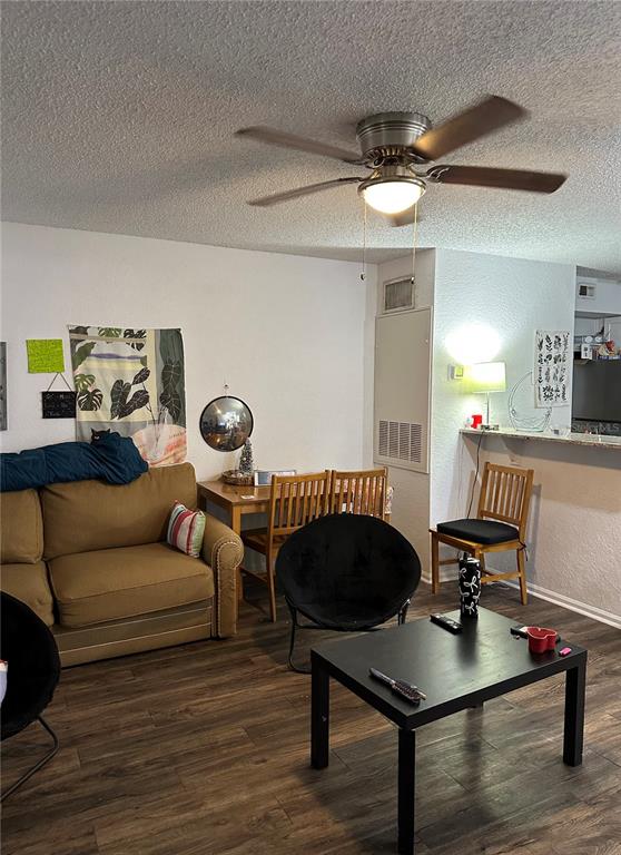 2214 Metropolitan Way, Unit 2210 Orlando, FL 32839 - Photo 4 of 14 a living room with furniture and wooden floor
