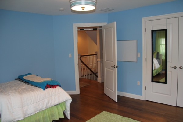 36 Rae Avenue Needham, MA 02492 - Photo 11 of 12 a bedroom with a bed and wooden floor