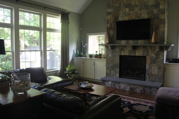 36 Rae Avenue Needham, MA 02492 - Photo 3 of 12 a living room with furniture a flat screen tv and a fireplace