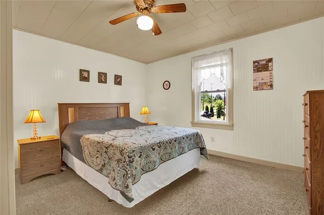 a bedroom with a bed and window