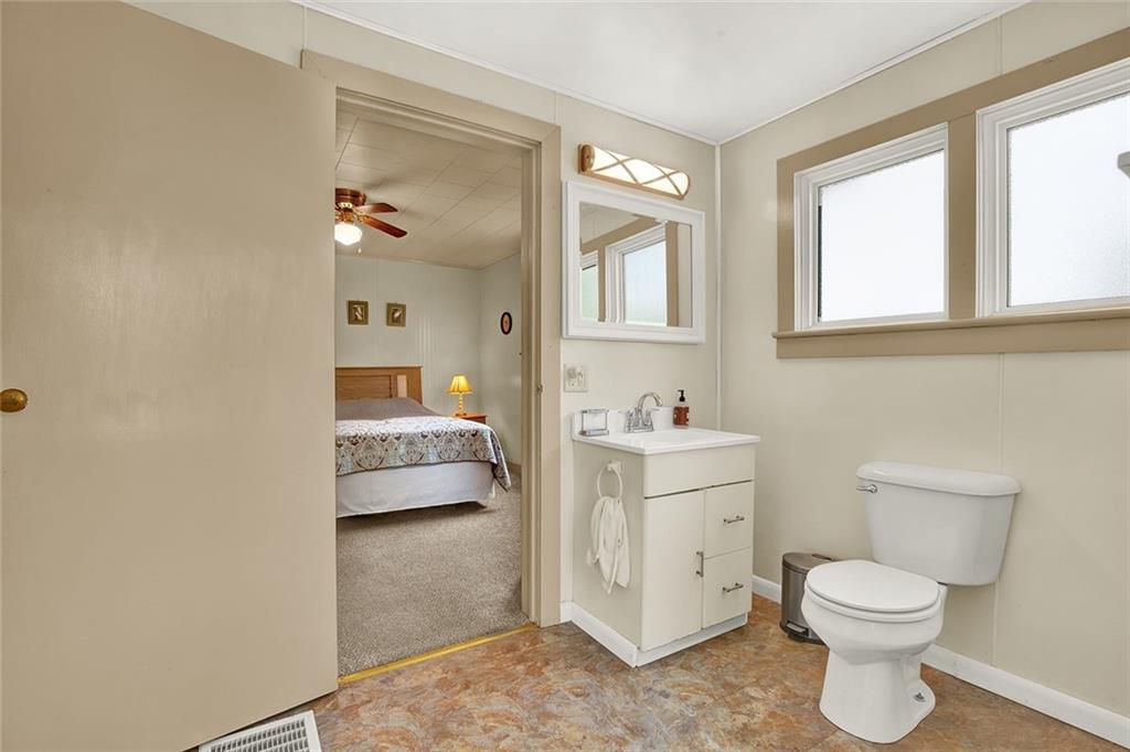 575 Stoystown Road Somerset, PA 15501 - Photo 14 of 26 a bathroom with a toilet sink and mirror