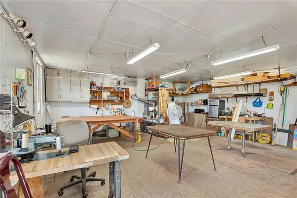 a view of a room with lots of wooden furniture