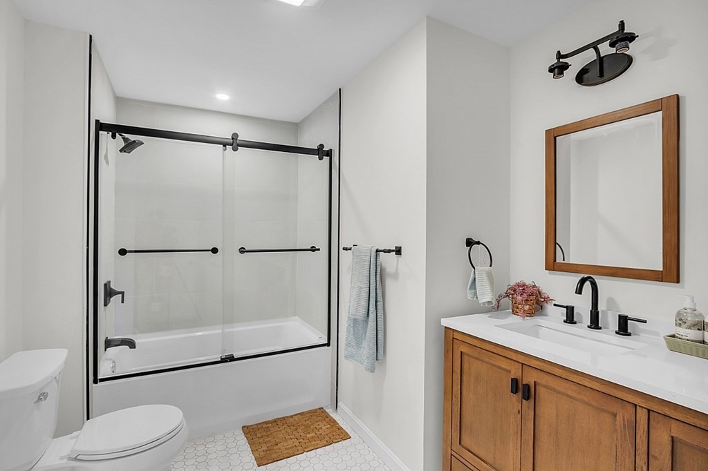 102 Turnpike Road Ashby, MA 01431 - Photo 12 of 40 a bathroom with a shower sink vanity mirror and toilet