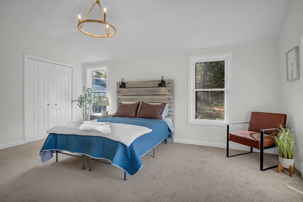 102 Turnpike Road Ashby, MA 01431 - Photo 14 of 40 a bedroom with a bed and a window