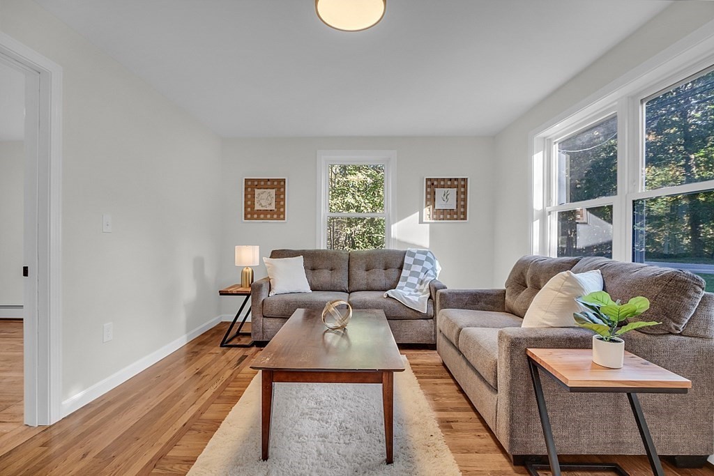 102 Turnpike Road Ashby, MA 01431 - Photo 16 of 40 a living room with furniture and a potted plant
