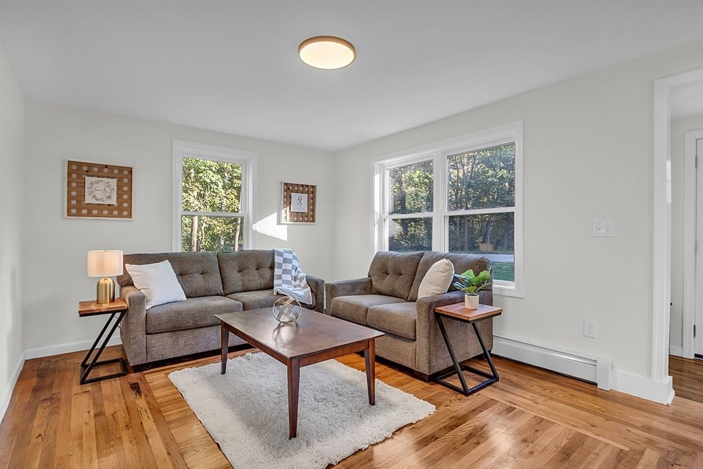 102 Turnpike Road Ashby, MA 01431 - Photo 17 of 40 a living room with furniture and a window