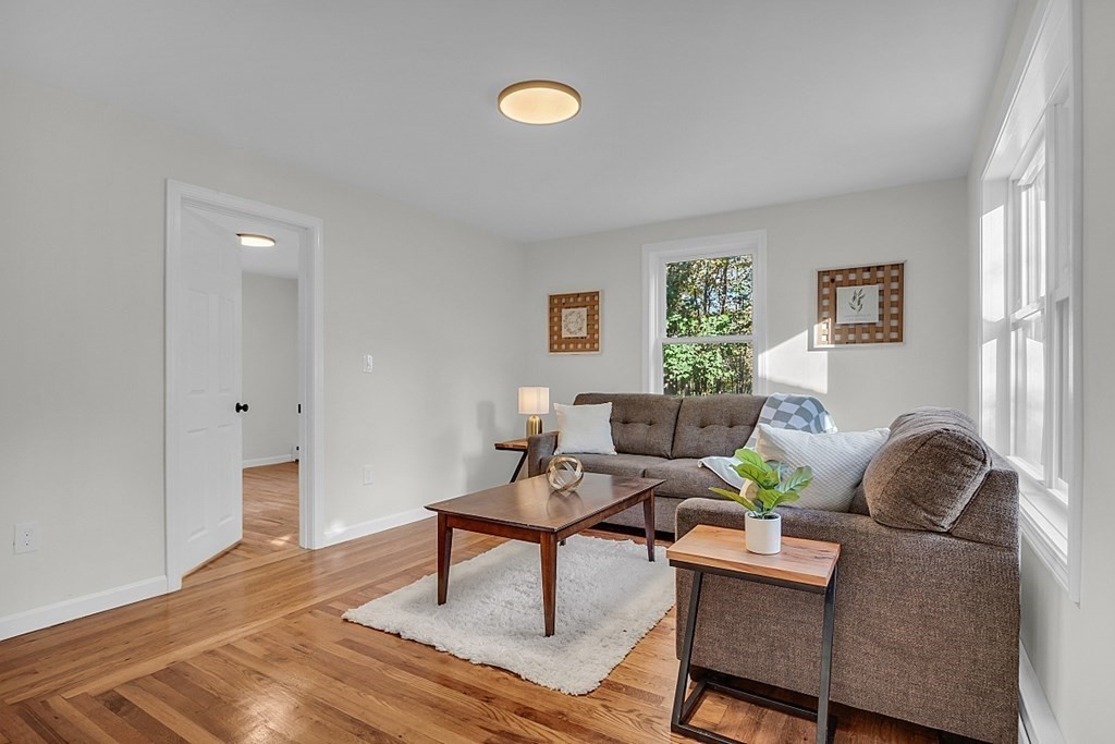 102 Turnpike Road Ashby, MA 01431 - Photo 18 of 40 a living room with furniture and a window